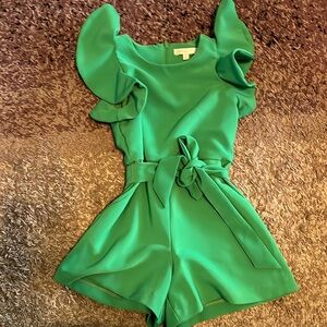 GB girls green kids romper with ruffles and tie belt.